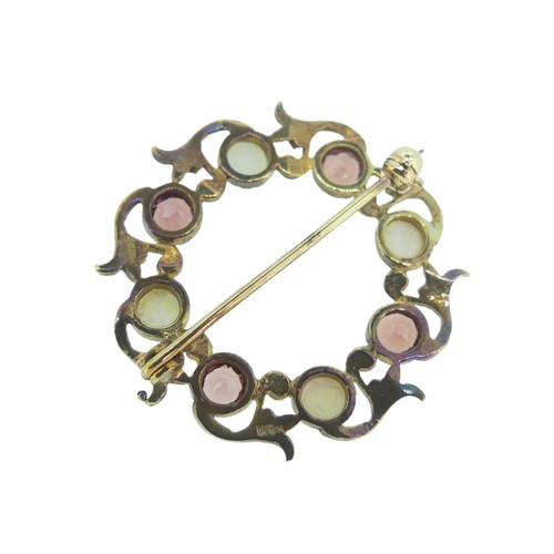 205 - A 9ct gold open Wreath Brooch, with four claw set pink pastes and four half cultured pearls, 3cm dia... 