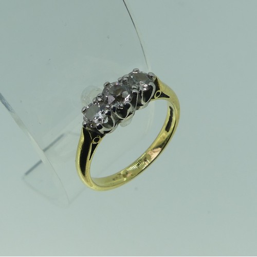 120 - A three stone diamond Ring, the central stone approx. 3.5ct, with a smaller stone on either side, ea... 