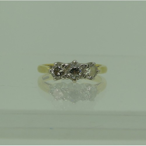 120 - A three stone diamond Ring, the central stone approx. 3.5ct, with a smaller stone on either side, ea... 