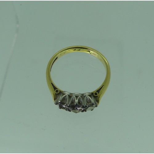 120 - A three stone diamond Ring, the central stone approx. 3.5ct, with a smaller stone on either side, ea... 