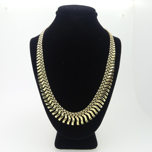 164 - A 9ct yellow gold 'Cleopatra' fringe Necklace, 41cm long, 18.g.