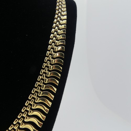 164 - A 9ct yellow gold 'Cleopatra' fringe Necklace, 41cm long, 18.g.