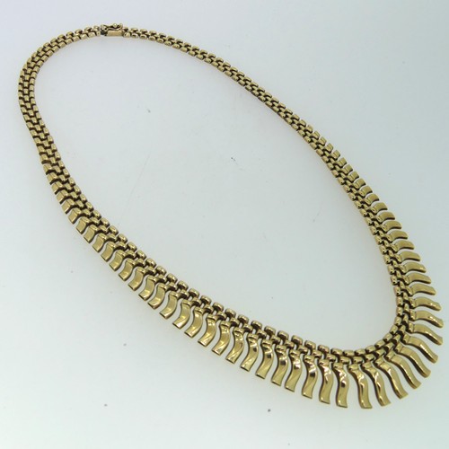 164 - A 9ct yellow gold 'Cleopatra' fringe Necklace, 41cm long, 18.g.