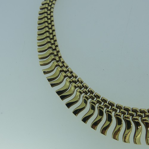 164 - A 9ct yellow gold 'Cleopatra' fringe Necklace, 41cm long, 18.g.