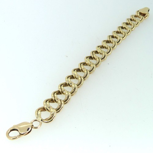 183 - A 9ct gold double circular link Bracelet, 15mm wide, 19cm long, and with one spare link removed, tot... 