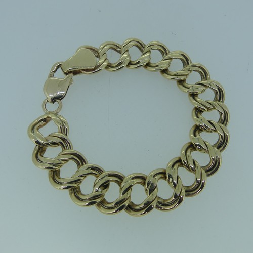 183 - A 9ct gold double circular link Bracelet, 15mm wide, 19cm long, and with one spare link removed, tot... 