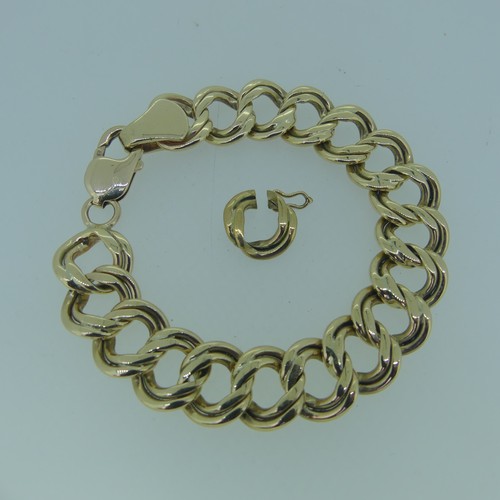 183 - A 9ct gold double circular link Bracelet, 15mm wide, 19cm long, and with one spare link removed, tot... 