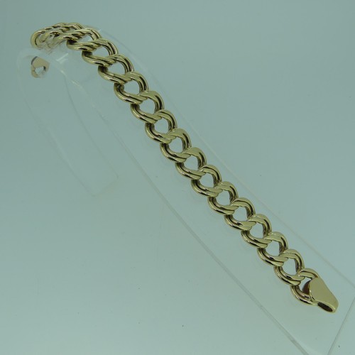 183 - A 9ct gold double circular link Bracelet, 15mm wide, 19cm long, and with one spare link removed, tot... 