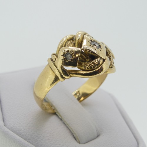 123 - An 18ct yellow gold Ring, the scrolling knot front gypsy set three diamond points, hallmarked Cheste... 