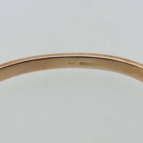 186 - A plain 9ct rose gold hollow hinged Bangle, 6.2g.