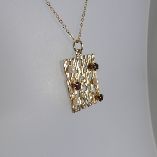 170 - A 9ct yellow gold, cultured pearl and garnet Pendant, of pierced textured rectangular form in the 19... 