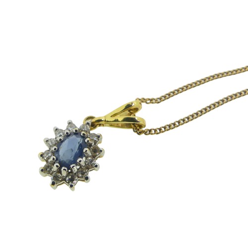 171 - A small sapphire and diamond cluster Pendant, the oval facetted pale sapphire approx 5.5mm long surr... 