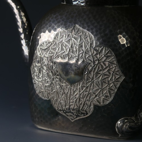 38 - An early 20thC Chinese export silver three piece Tea Set, of cube form with rounded shoulders, hamme... 