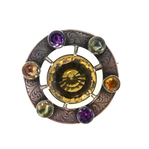 210 - An attractive Scottish circular silver Brooch, the central facetted citrine 23mm diameter, set above... 