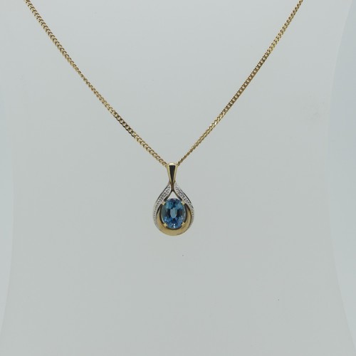 173 - A 9ct gold pear shaped Pendant, the centre with a facetted oval blue topaz, 8.9mm long, total length... 