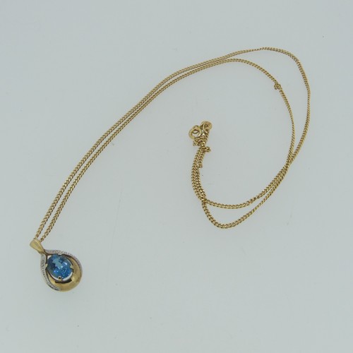 173 - A 9ct gold pear shaped Pendant, the centre with a facetted oval blue topaz, 8.9mm long, total length... 