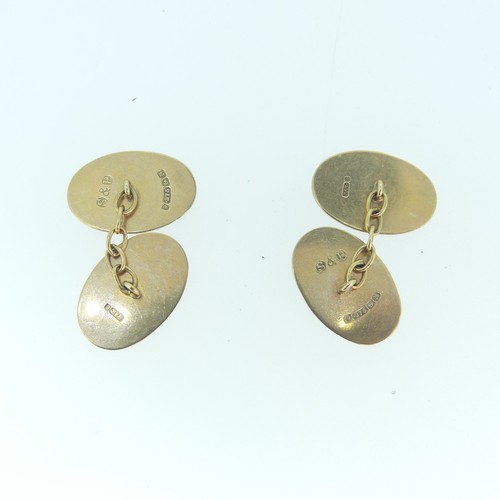 264 - A pair of 9ct yellow gold oval Cufflinks, each side engraved with starburst design, chain between, 4... 