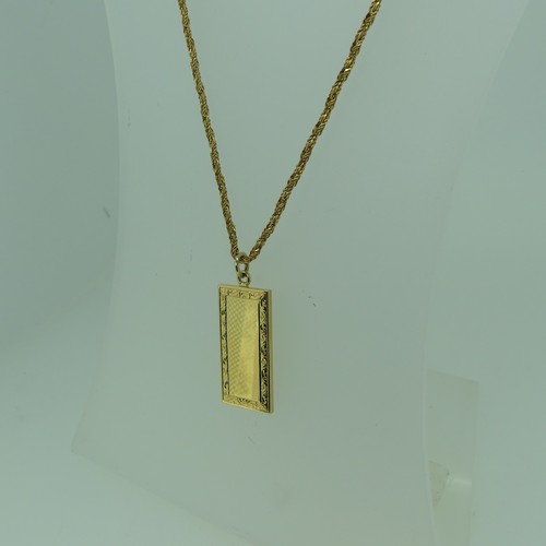 175 - An 18ct yellow gold Ingot style Pendant, the vacant centre with foliate engraved border, 35mm long, ... 