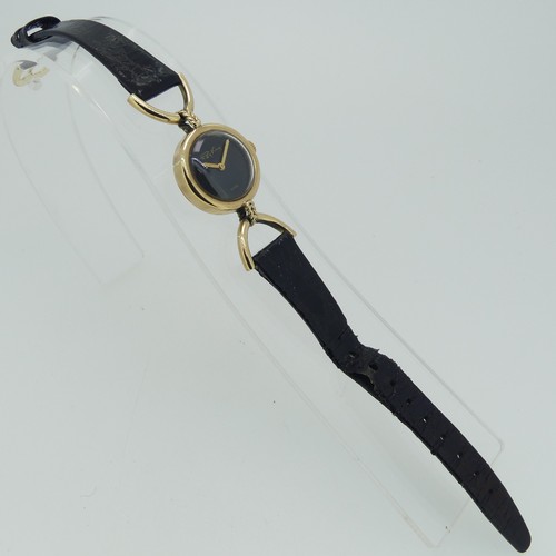 294 - A 9ct yellow gold Roy King lady's Wristwatch, hallmarked London, 1976, the signed plain black dial w... 