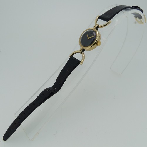 294 - A 9ct yellow gold Roy King lady's Wristwatch, hallmarked London, 1976, the signed plain black dial w... 