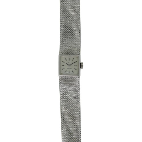 295 - A 9ct white gold lady's Omega bracelet Wristwatch, hallmarked London 1970, the square silvered dial ... 