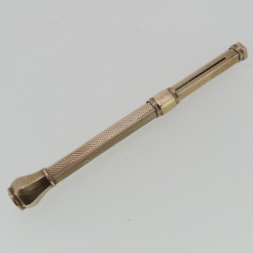 275 - A yellow metal Propelling Pencil, unmarked but tested as 9ct gold, with engine turned decoration, va... 