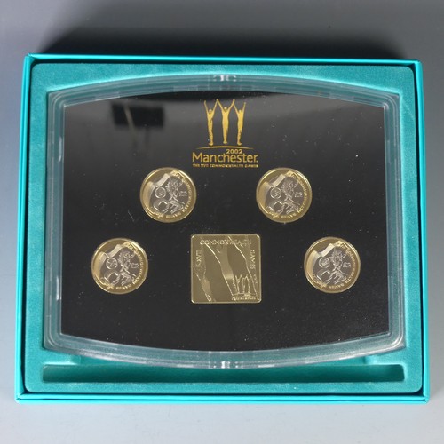 348 - A Royal Mint 2002 Manchester Commonwealth Games Commemorative Coin Set, with four proof £2 Coi... 