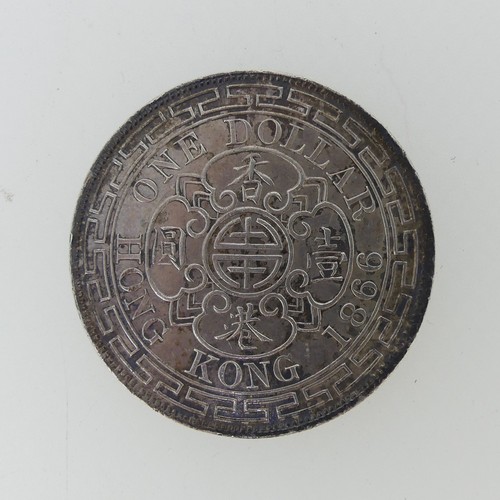 306 - An 1866 Hong Kong Dollar, the obverse with Victoria diademed head, the reverse with date and value, ...