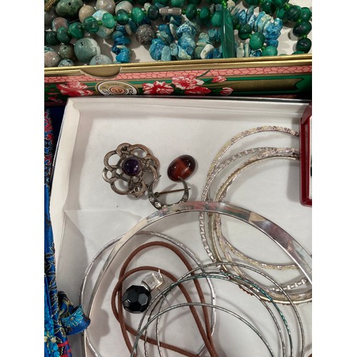 222 - A quantity of Costume Jewellery, including two malachite necklaces, a Celtic style silver brooch wit... 