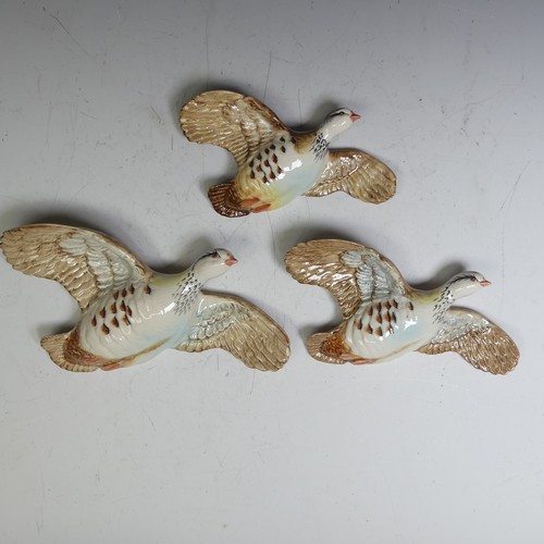 A set of three wall hanging Beswick flying Grouse, marked 1188-1, 2, 3 respectively (3)
