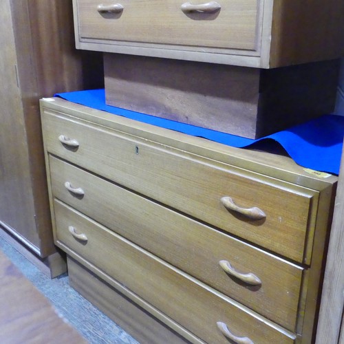 587 - A pair of Retro bedside Chest of Drawers/Cabinets, both with three drawers on raised bases, (Larger)... 