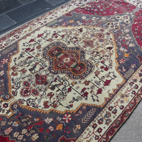 603 - Tribal Rugs; a large Persian Qashqai Rug, red, cream and grey ground with all over typical patterns,... 