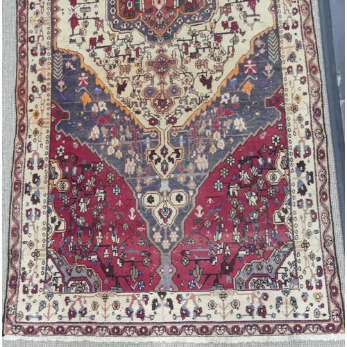 603 - Tribal Rugs; a large Persian Qashqai Rug, red, cream and grey ground with all over typical patterns,... 