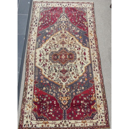 603 - Tribal Rugs; a large Persian Qashqai Rug, red, cream and grey ground with all over typical patterns,... 