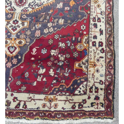 603 - Tribal Rugs; a large Persian Qashqai Rug, red, cream and grey ground with all over typical patterns,... 