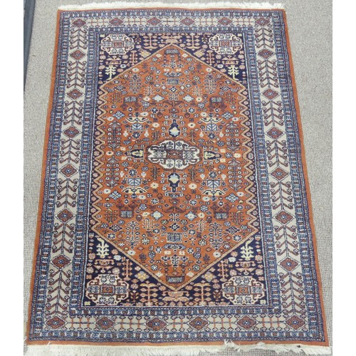 605 - Tribal Rugs; a Persian Qashqai Rug, light brown ground, wool pile on cotton base, 184cm x 130cm.... 