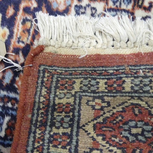 605 - Tribal Rugs; a Persian Qashqai Rug, light brown ground, wool pile on cotton base, 184cm x 130cm.... 