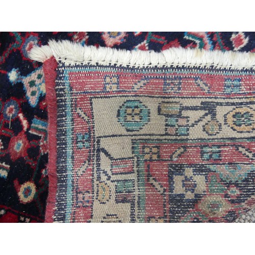 606 - Tribal Rugs; a Persian Herati Runner, very dark navy ground, wool pile on cotton base, 293cm x 113cm... 