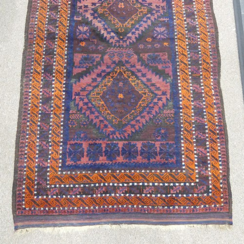 608 - Tribal Rugs; an old Afghan Rug, plum coloured ground with geometric patterned dark orange border, ti... 