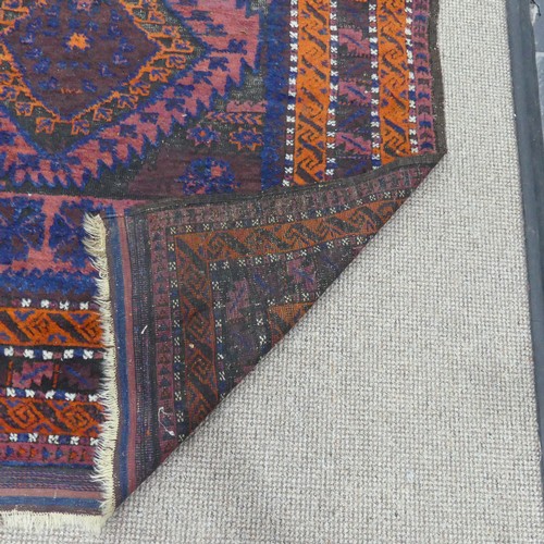 608 - Tribal Rugs; an old Afghan Rug, plum coloured ground with geometric patterned dark orange border, ti... 