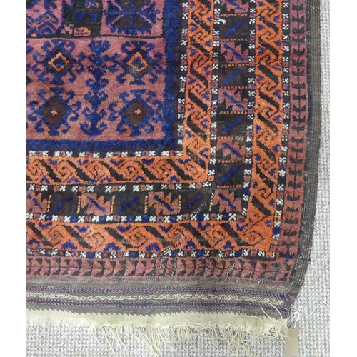 608 - Tribal Rugs; an old Afghan Rug, plum coloured ground with geometric patterned dark orange border, ti... 