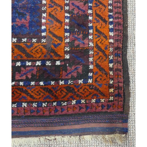 608 - Tribal Rugs; an old Afghan Rug, plum coloured ground with geometric patterned dark orange border, ti... 