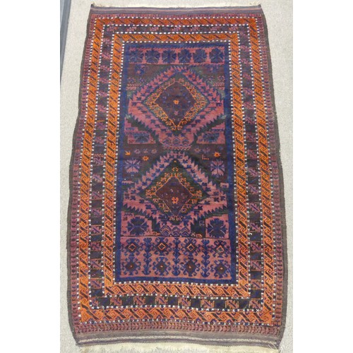 608 - Tribal Rugs; an old Afghan Rug, plum coloured ground with geometric patterned dark orange border, ti... 