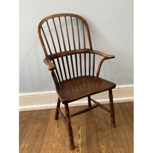 524 - A 19thC Country ash and elm hoopback windsor Armchair, with a spindle filled back above a shaped sad... 