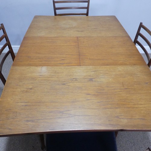 594 - A mid-20thC Meredew teak extending Dining Table, W 102.5 cm x H 85.5 cm x D 42 cm, together with a s... 