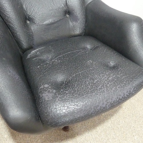 597 - A 1960s Parker Knoll 'Statesman' swivel/recline Chair, in black vinyl, W 82 cm x H 95 cm x D 80cm... 