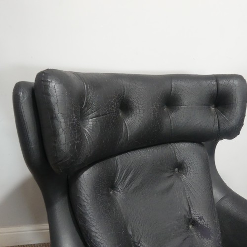 597 - A 1960s Parker Knoll 'Statesman' swivel/recline Chair, in black vinyl, W 82 cm x H 95 cm x D 80cm... 