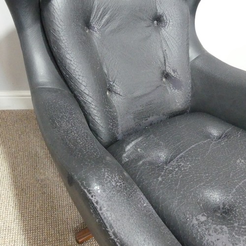 597 - A 1960s Parker Knoll 'Statesman' swivel/recline Chair, in black vinyl, W 82 cm x H 95 cm x D 80cm... 