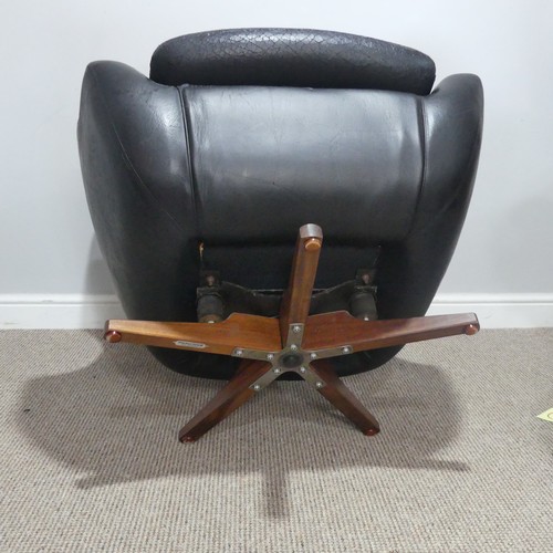 597 - A 1960s Parker Knoll 'Statesman' swivel/recline Chair, in black vinyl, W 82 cm x H 95 cm x D 80cm... 