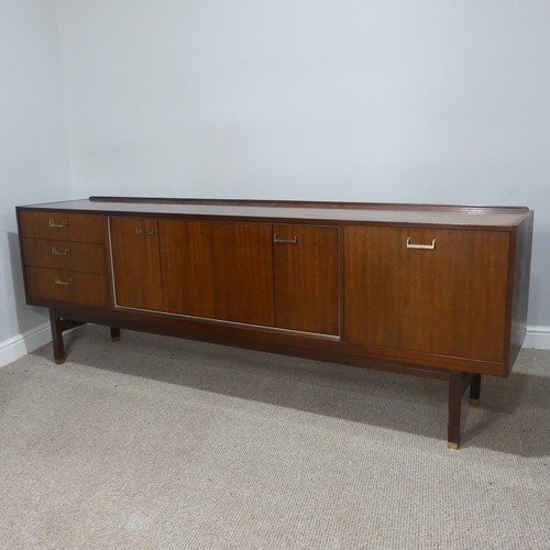 598 - A 1960's G-Plan teak Sideboard by E Gomme, central cupboard with folding doors, drop down front and ... 